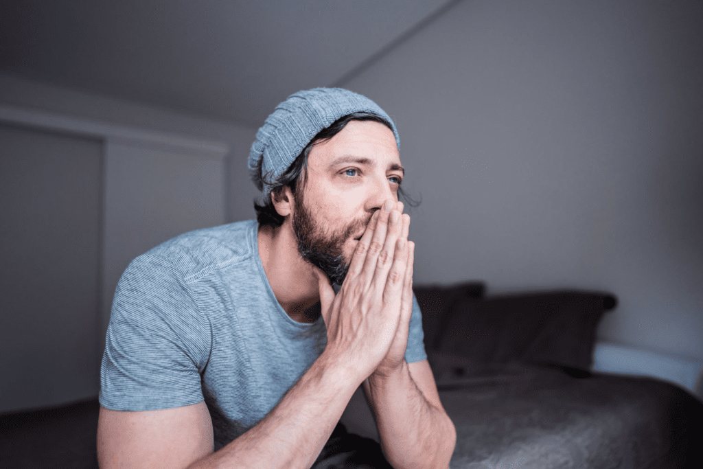 a man thinking about the discomfort of life